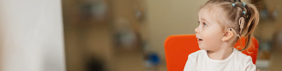 Young girl with a cochlear implant.