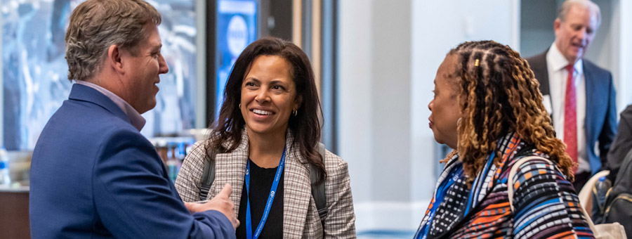 Conference attendees talking.