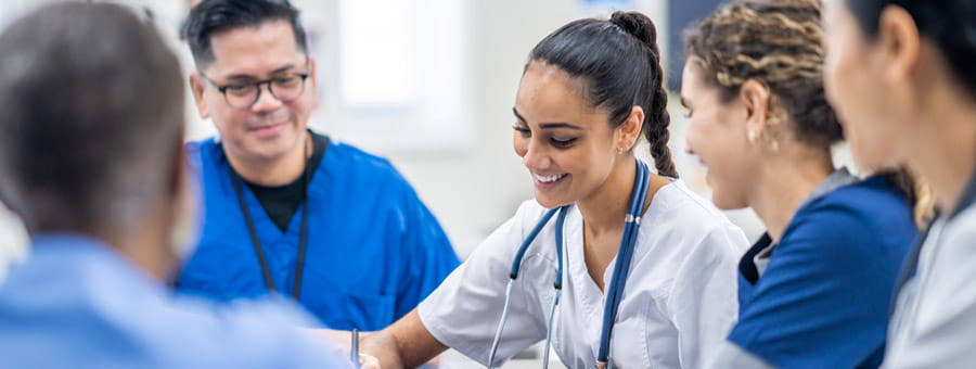 Diverse group of nurses work together on a case.
