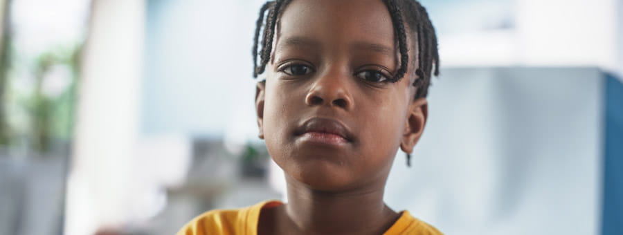 Portrait of serious young boy.