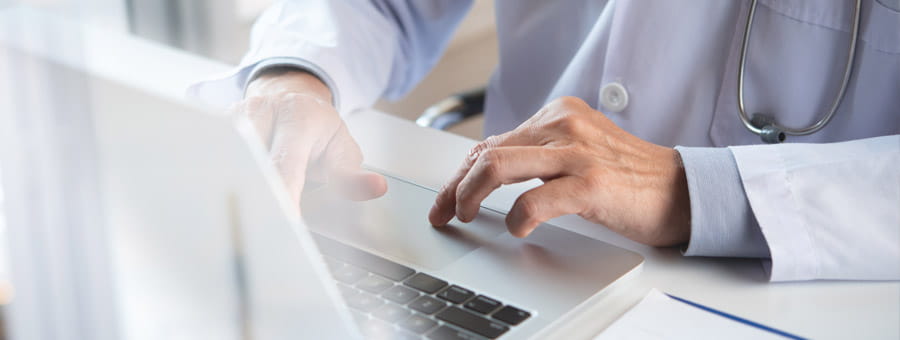 Doctor submitting an online report.