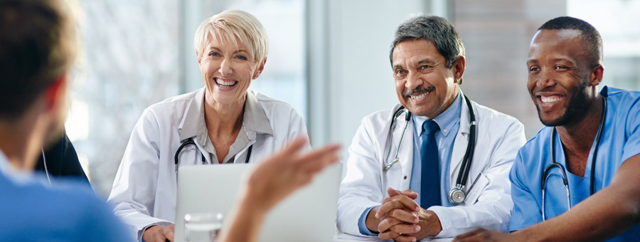 Group of hospital staff talking.