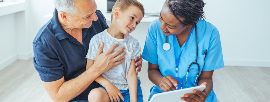 A father and son schedule an appointment with their doctor.