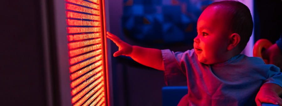 Child in a sensory-friendly room at Dayton Children's Hospital.