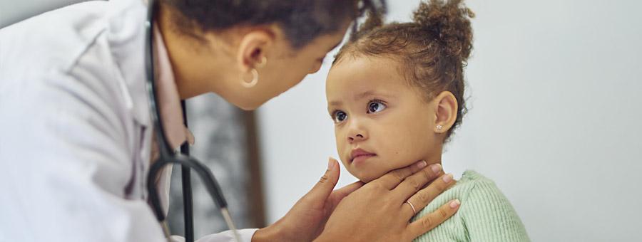 Doctor examining young patient.