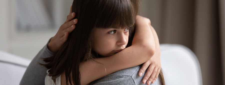 Parent and child hugging.
