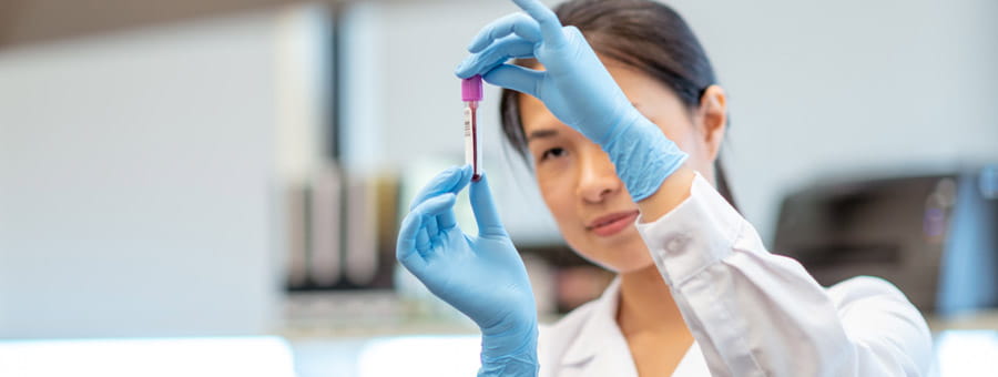 Performing a test in hospital lab.