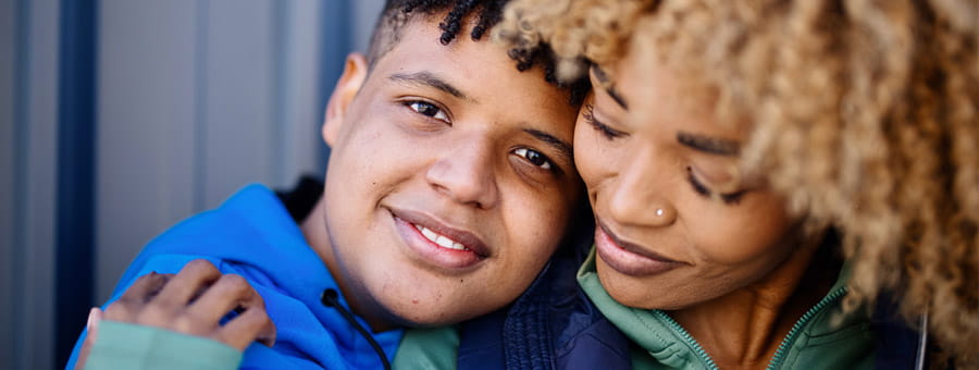 A mom and son sitting together.