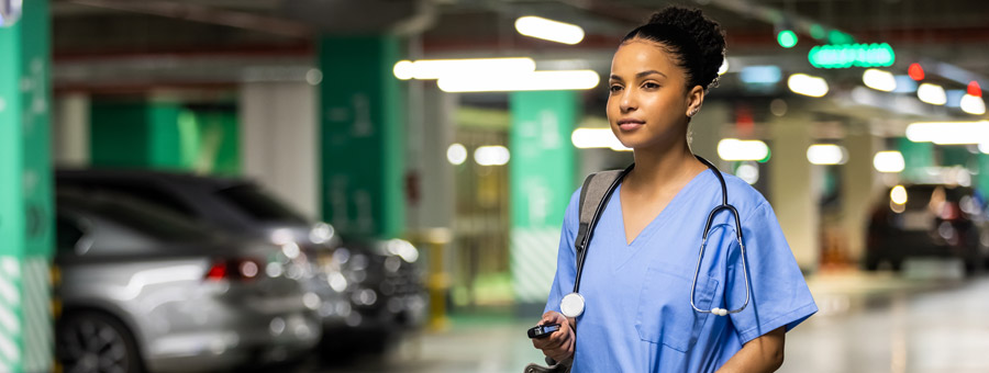 Medical staff walking in parking garage.