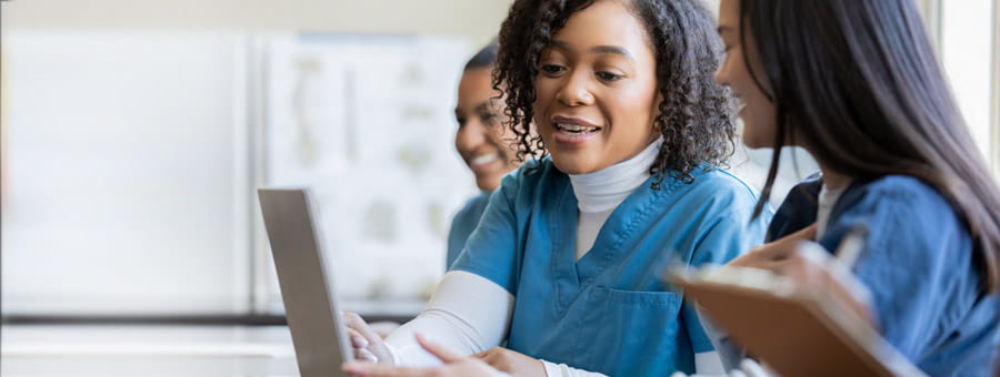 Nurses talking and studying.