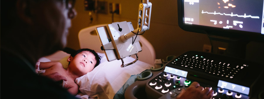 Radiology tech with child.