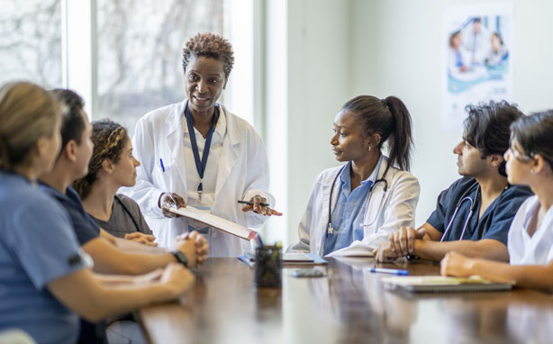 Respiratory therapist mentors and mentees attend meeting.