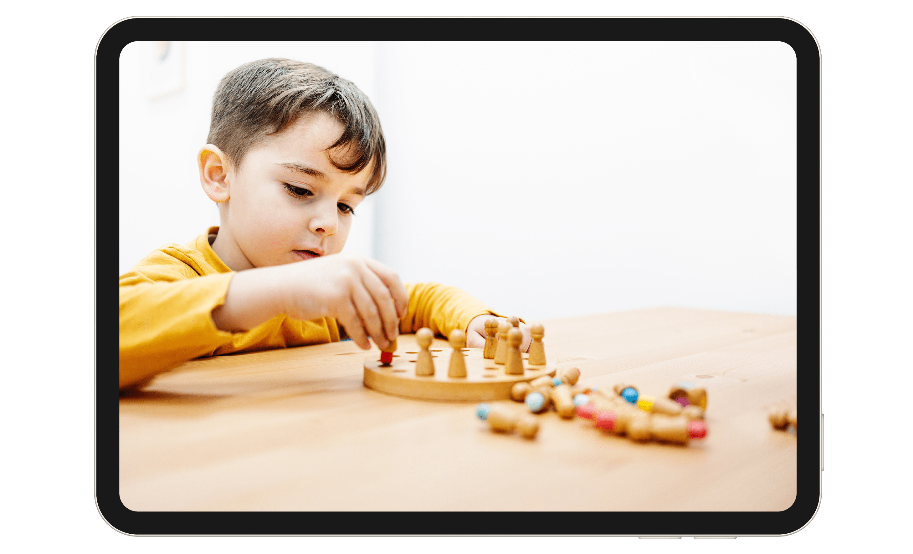 Child playing with toys at a table.