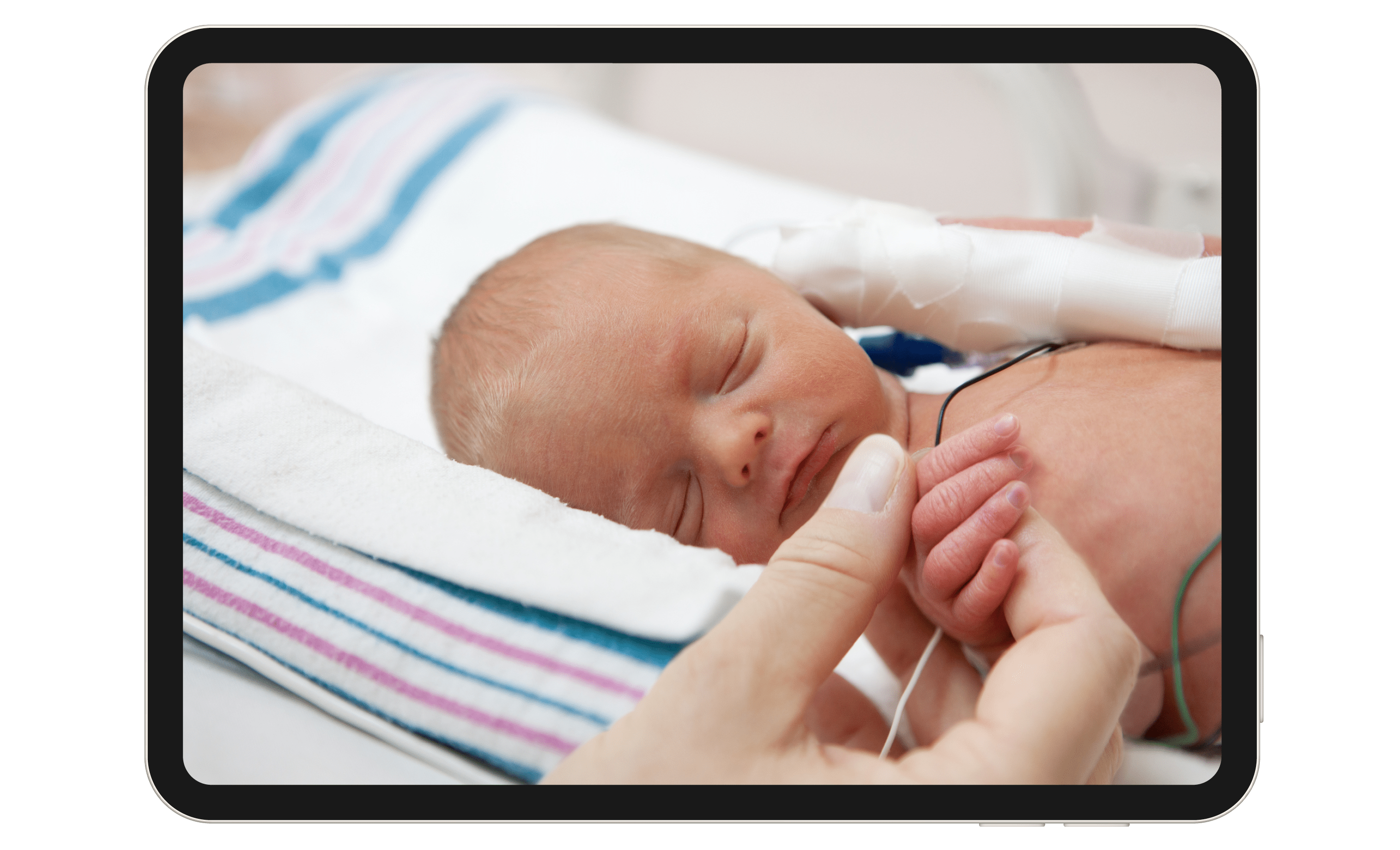 Adult hand holding a newborn infant. 