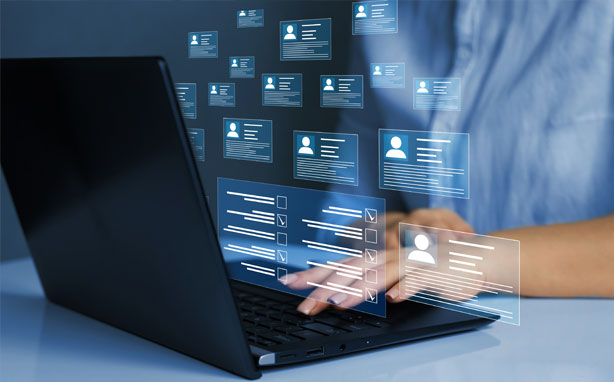 A person types on a laptop.