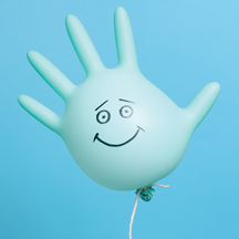 Surgical glove balloon with happy face drawn on it.