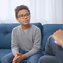 Boy talks to counselor.