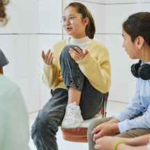 Teen girls talk in a support group.