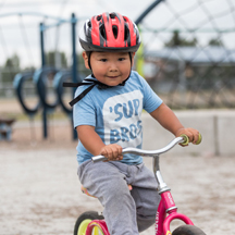 Boy riding bike at playground