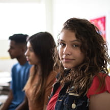 Group portrait of serious teens.