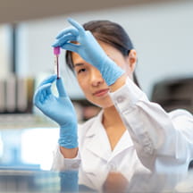 Performing a test in hospital lab.