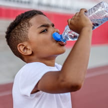 Kids drinking water.