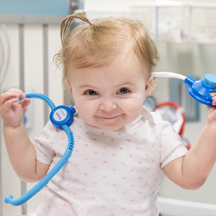 Baby with toy stethoscope
