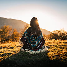 Young woman watching the sunrise.