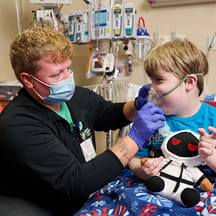 A respiratory therapist and child patient. 